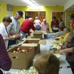 Pie night! Church members peeling apples for 82 apple pies. 